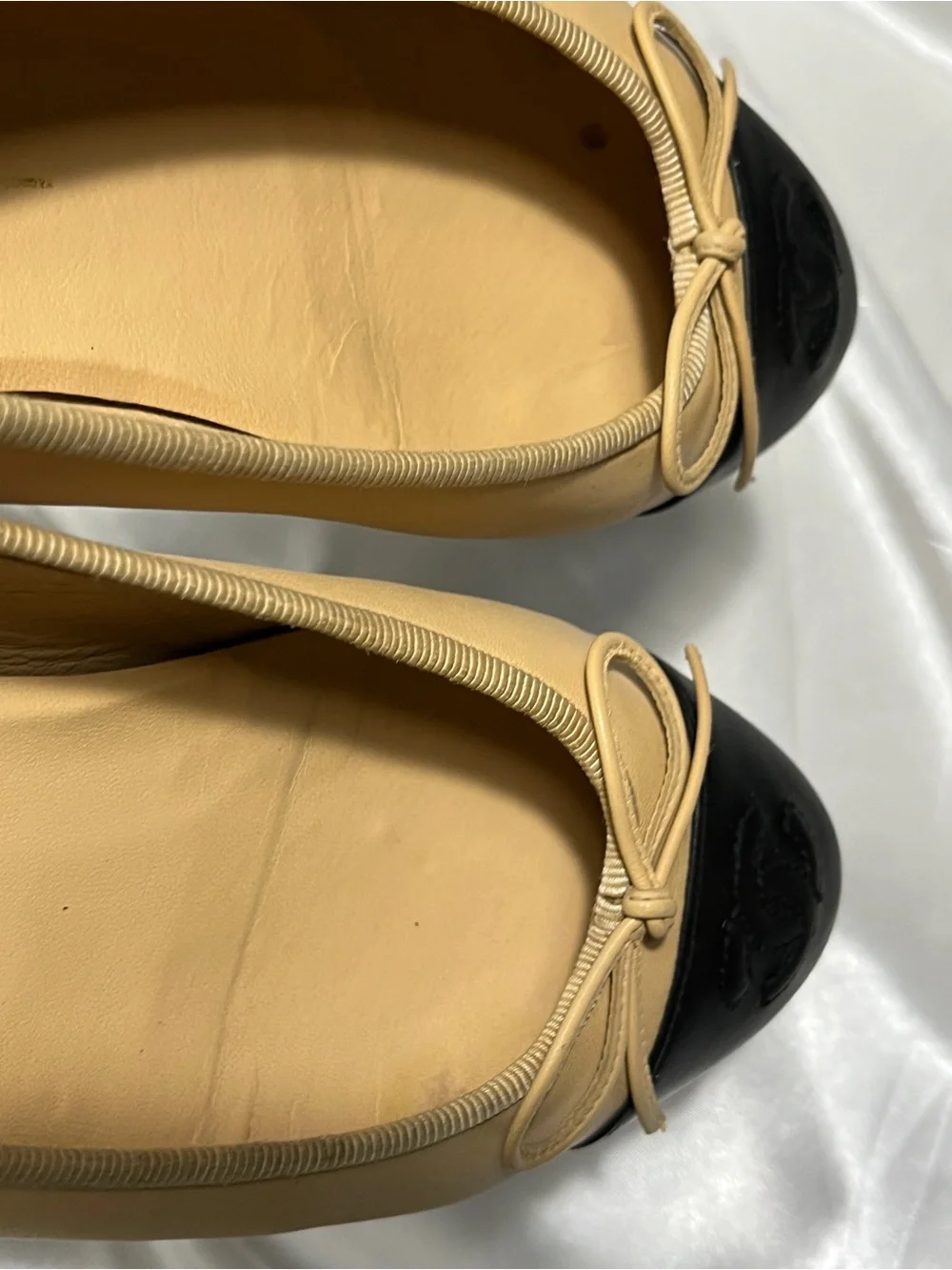 CHANEL Beige Leather Ballet Flats with Black Cap Toe and CC Logo
